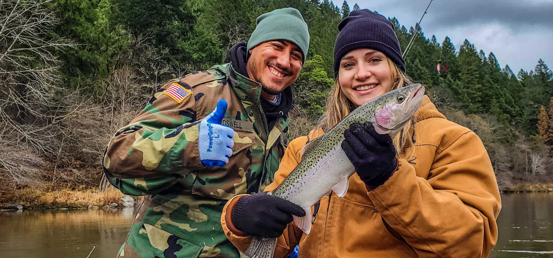 Couple with fish on guided rogue river fishing trip